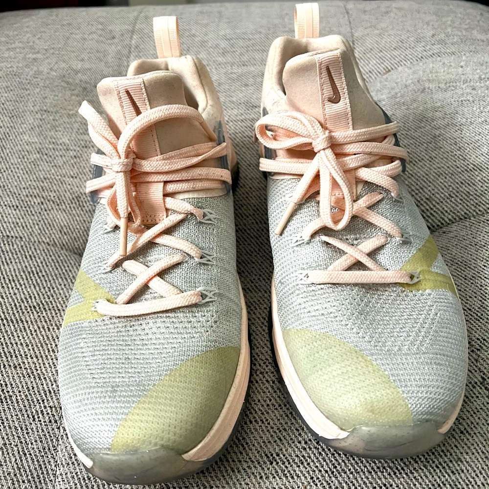 Pink and Gray Nike running shoes